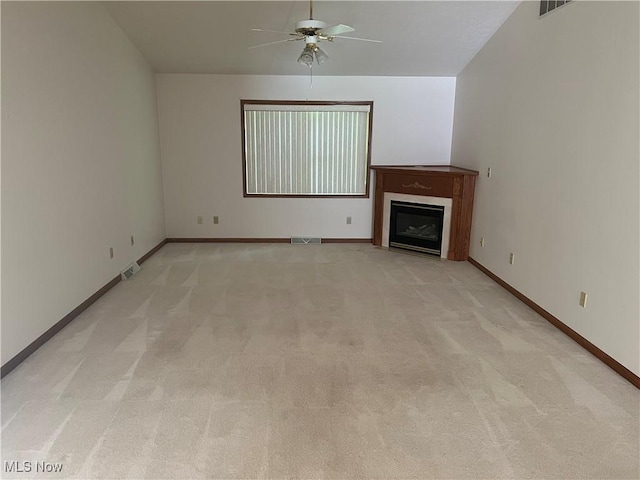 6695 Clingan Rd Unit 26, Poland, OH 44514 - unfurnished living room featuring ceiling fan, light carpet, a fireplace, and baseboards