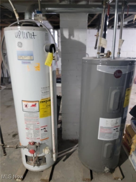 utility room featuring water heater and electric water heater