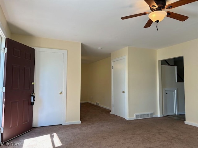 unfurnished room with carpet flooring