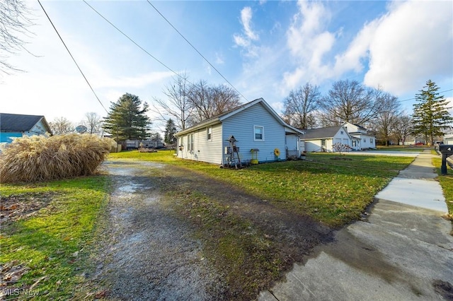 view of property exterior featuring a yard