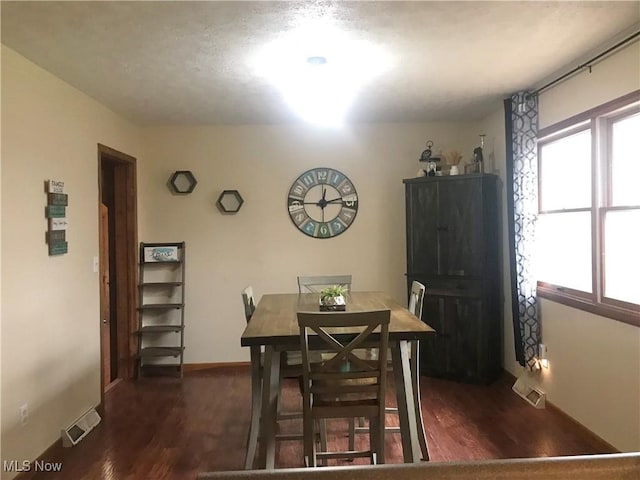 dining room featuring dark wood-type flooring