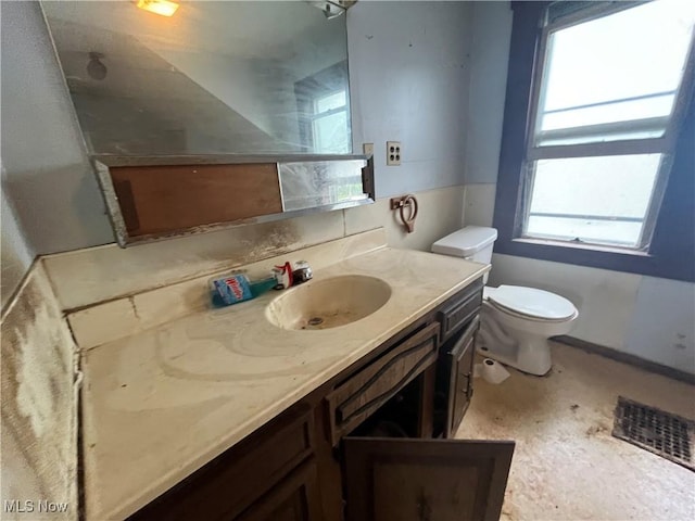 bathroom with vanity and toilet