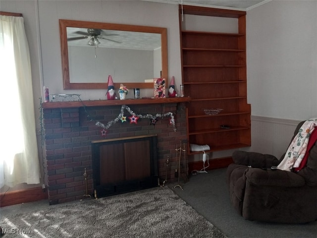 carpeted living room featuring a fireplace and built in shelves