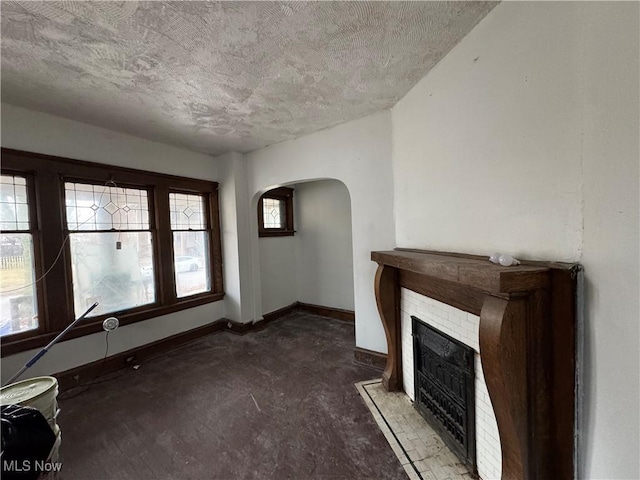 unfurnished living room featuring a textured ceiling