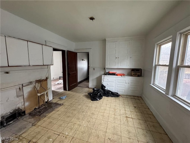 kitchen featuring white cabinets