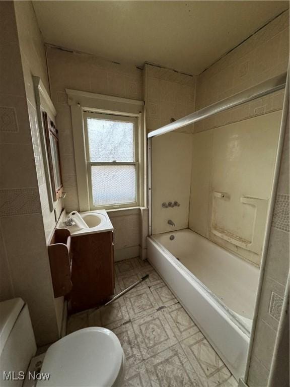 full bathroom featuring vanity,  shower combination, and toilet