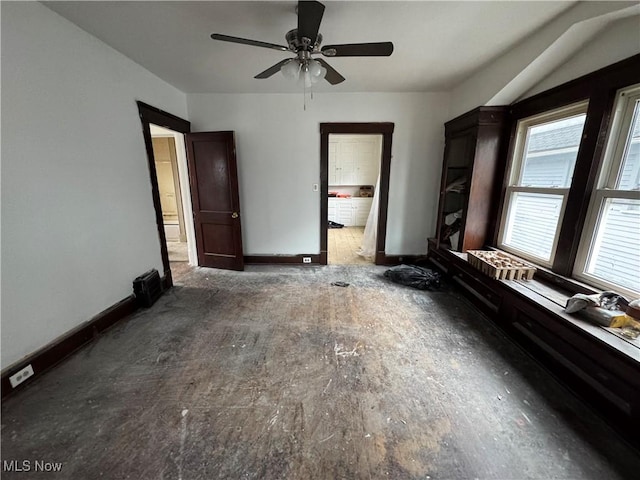 unfurnished bedroom featuring ceiling fan and ensuite bathroom