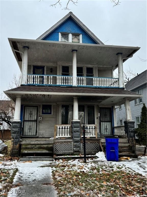 view of front of property with a porch and a balcony