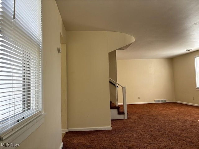 basement with dark colored carpet