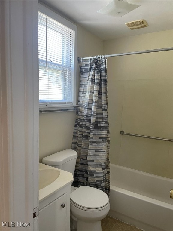 full bathroom featuring vanity, tile patterned floors, shower / bath combination with curtain, and toilet