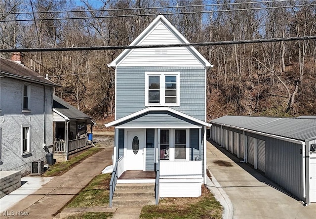 front of property featuring central AC and a porch