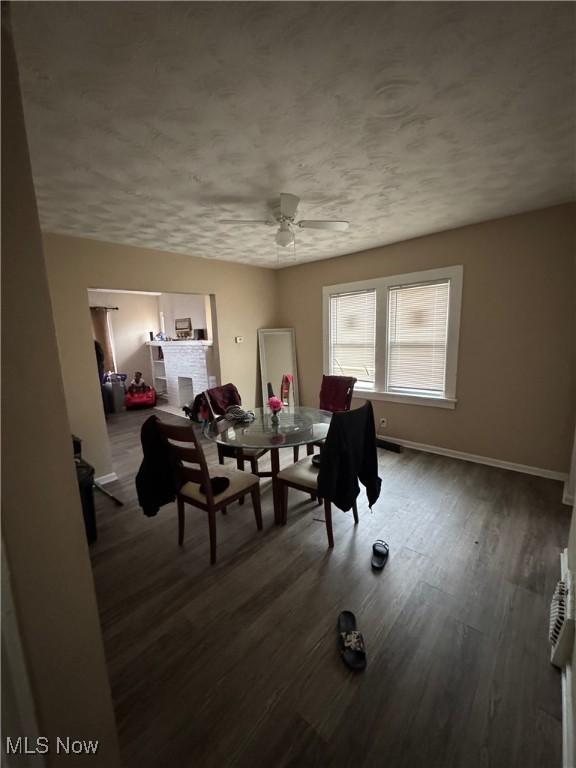 dining room featuring ceiling fan and dark hardwood / wood-style floors