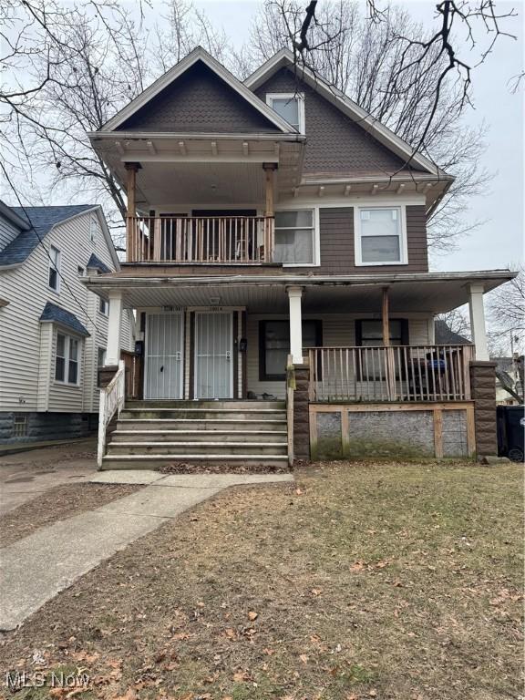 view of front of home with a balcony and covered porch