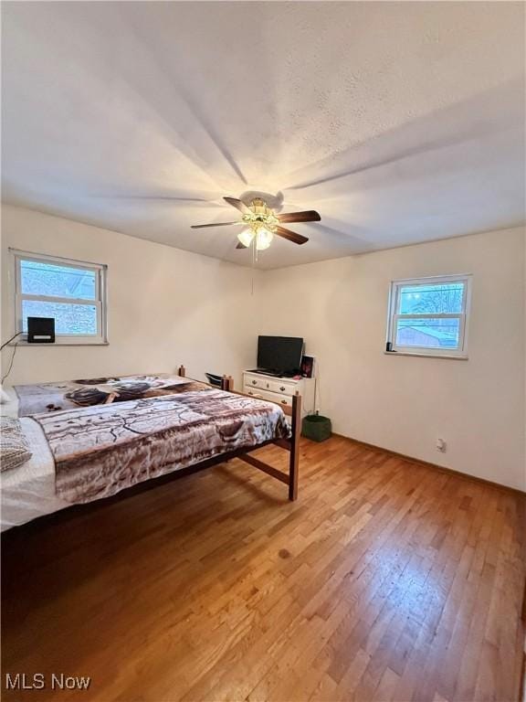 bedroom featuring ceiling fan and light wood-type flooring