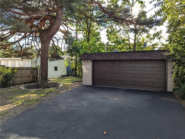 detached garage with fence