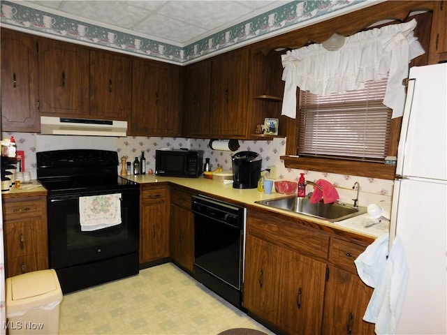 kitchen featuring sink and black appliances