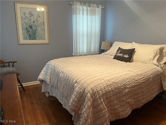 bedroom with wood-type flooring