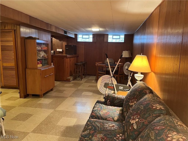 living room featuring wooden walls