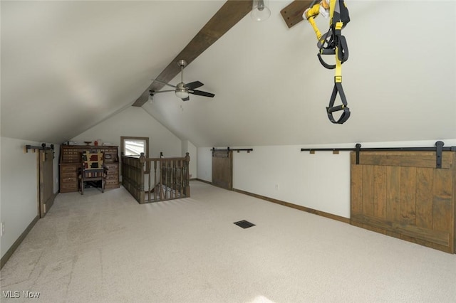 additional living space featuring lofted ceiling with beams, light carpet, and ceiling fan