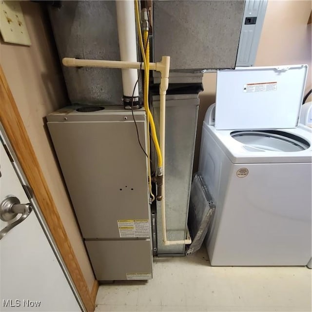 utility room featuring washer / dryer