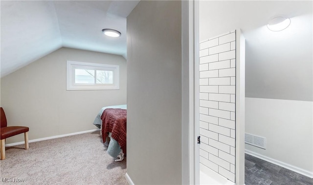 carpeted bedroom featuring lofted ceiling