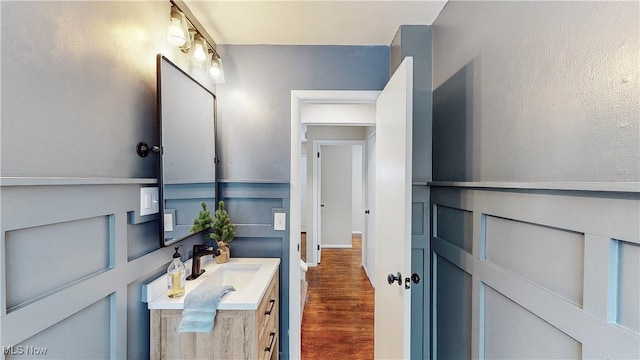 bathroom with vanity and hardwood / wood-style flooring