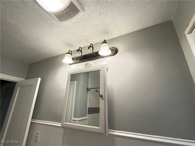 bathroom with a textured ceiling