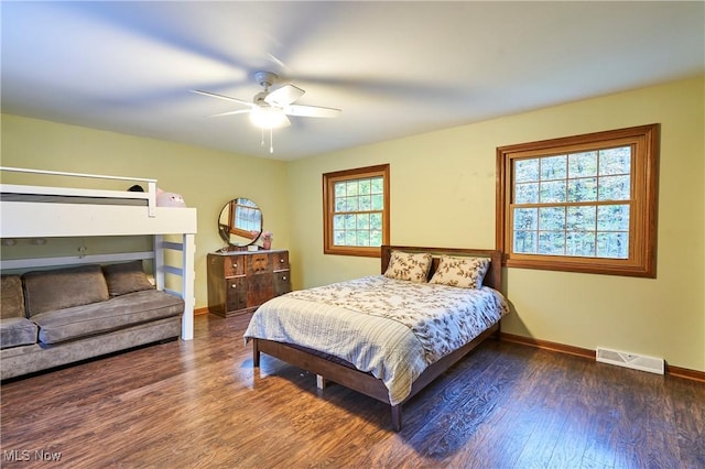 bedroom featuring ceiling fan and dark hardwood / wood-style floors