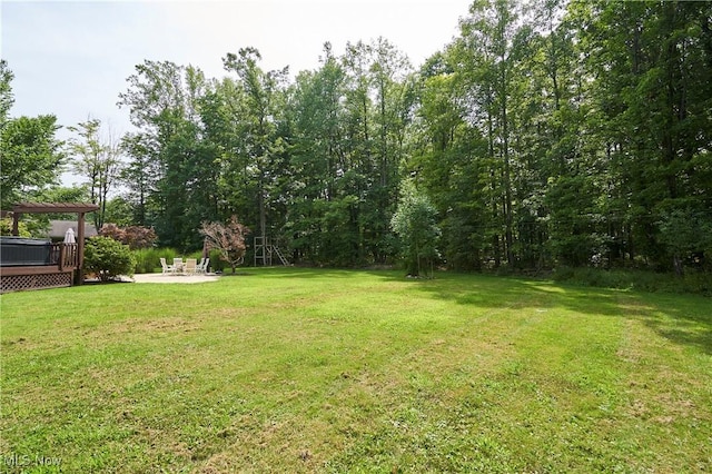 view of yard with a pergola and a wooden deck