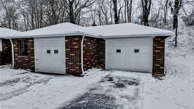 view of snow covered garage