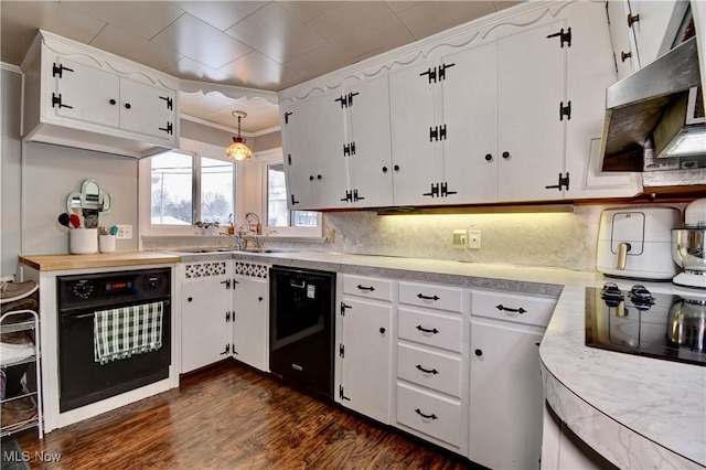 kitchen with dark hardwood / wood-style flooring, decorative light fixtures, black appliances, sink, and white cabinets