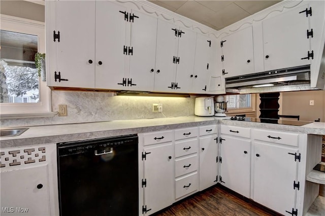 kitchen featuring plenty of natural light, tasteful backsplash, white cabinetry, and black appliances