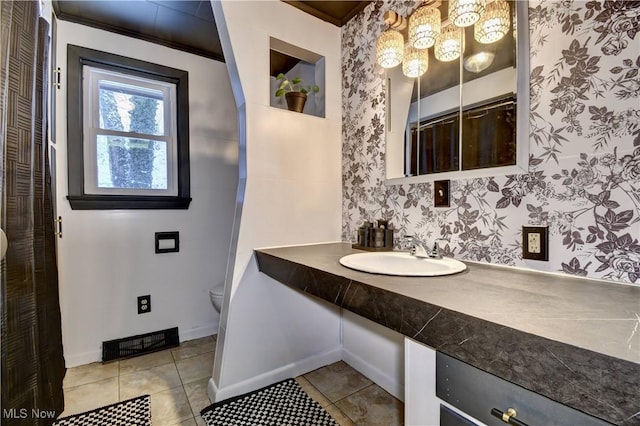 bathroom with sink, tile patterned flooring, and toilet