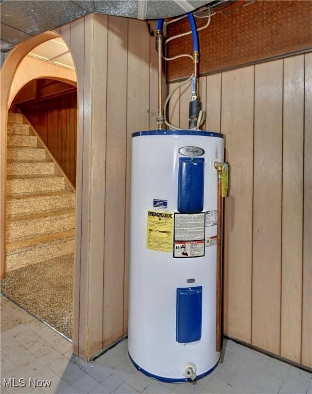 utility room featuring water heater