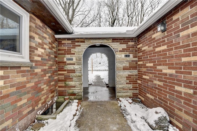 view of snow covered property entrance