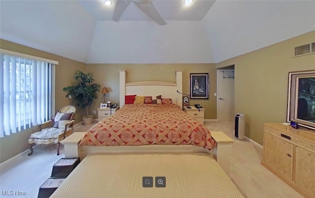 bedroom with vaulted ceiling and light colored carpet