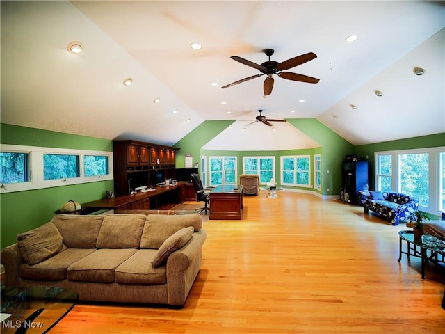 living room with vaulted ceiling and light hardwood / wood-style flooring