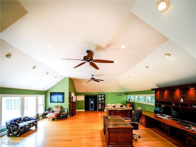 office space featuring light wood-type flooring and lofted ceiling