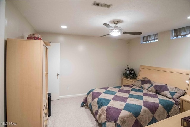 bedroom with light colored carpet and ceiling fan