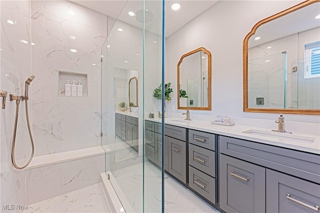 bathroom featuring an enclosed shower and vanity