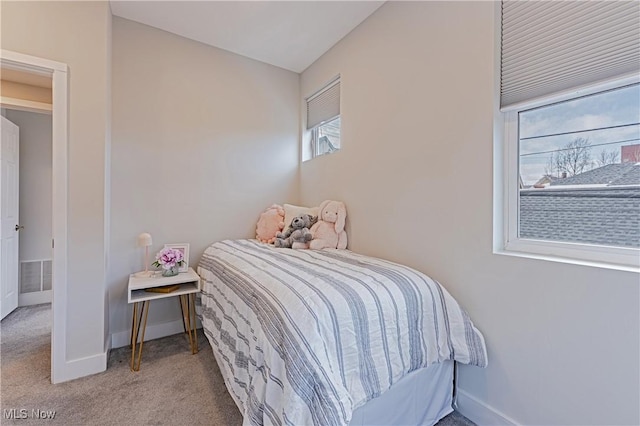 carpeted bedroom featuring lofted ceiling