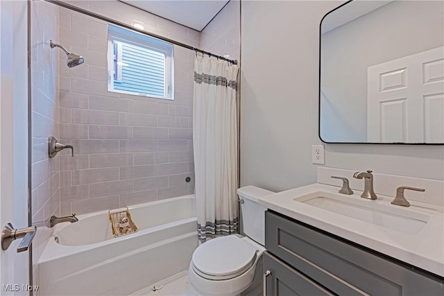 full bathroom with toilet, shower / tub combo with curtain, and vanity