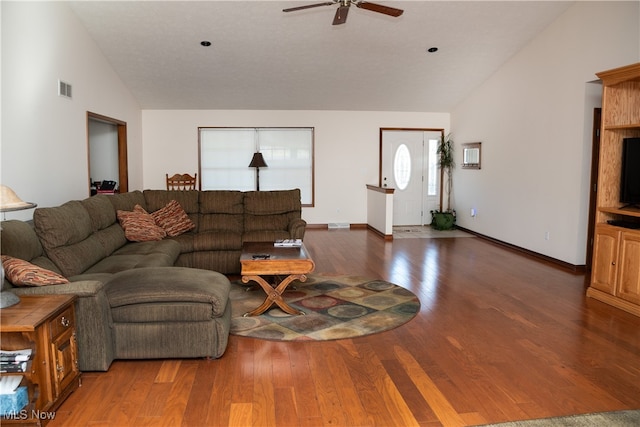 living room with ceiling fan, high vaulted ceiling, and dark wood-type flooring