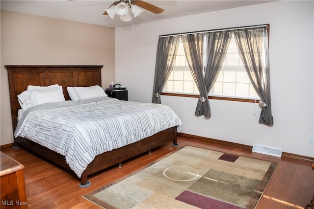 bedroom featuring hardwood / wood-style floors and ceiling fan