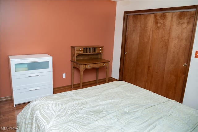 bedroom featuring a closet and hardwood / wood-style floors