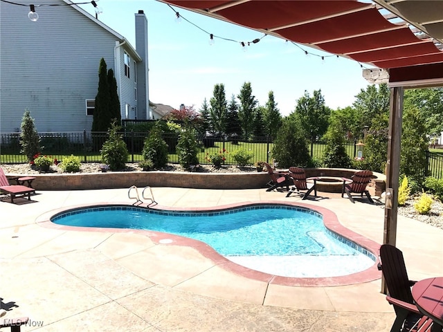 view of swimming pool with a fire pit, a pergola, and a patio area