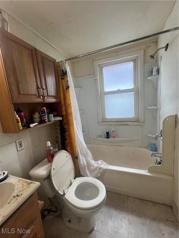 full bathroom featuring vanity, tile patterned flooring, toilet, and shower / bath combo