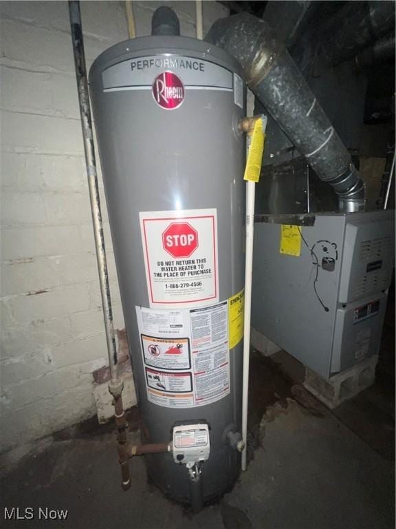 utility room with water heater