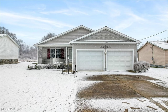 view of front facade featuring covered porch and a garage