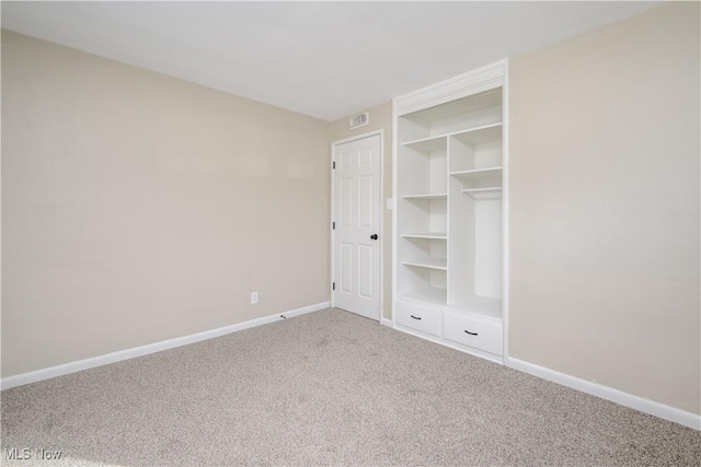 unfurnished bedroom with carpet floors and a closet